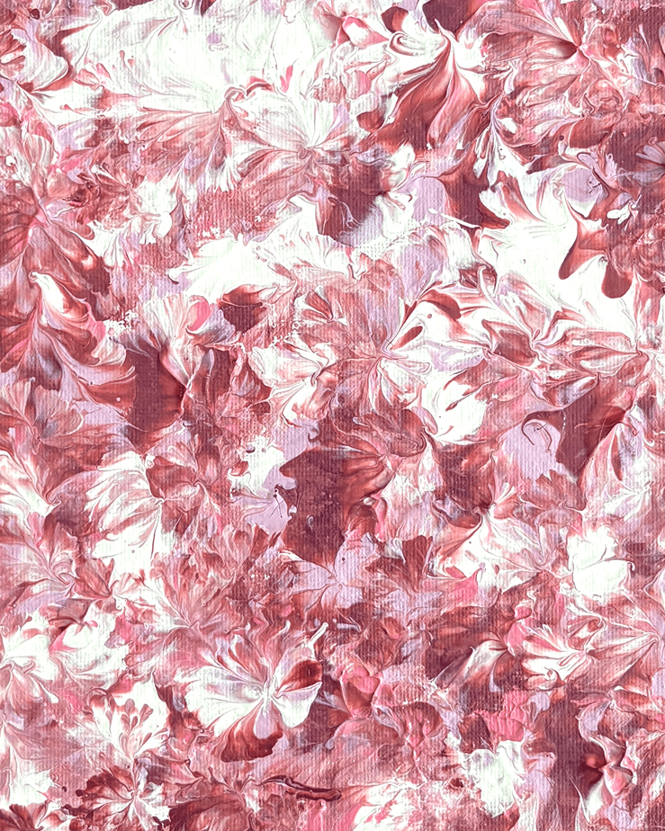 A close-up of a pink and white marbled or swirled surface with an abstract floral-like pattern filling the frame.