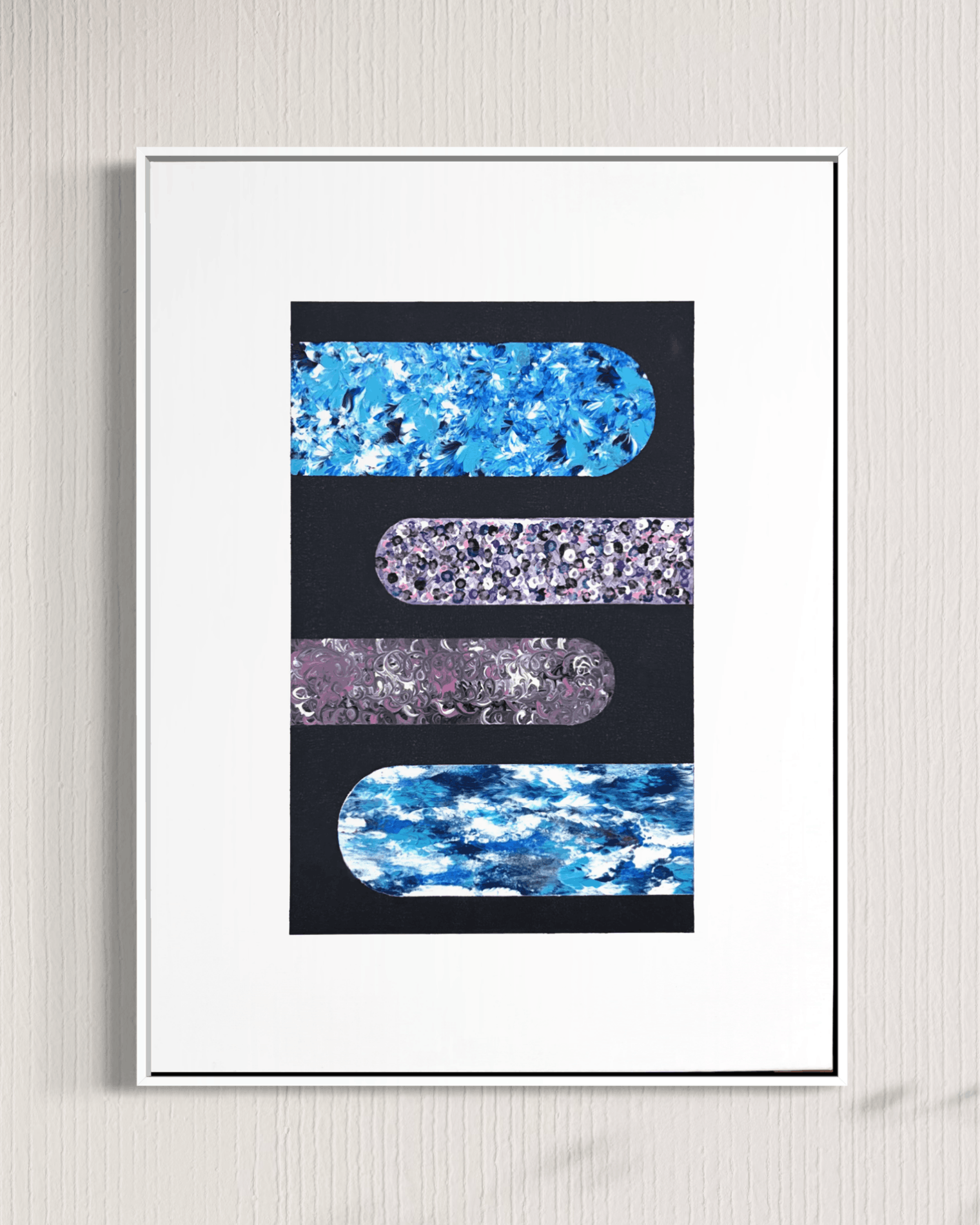A framed abstract art print featuring four horizontal rounded rectangular bands of blue, purple, and marbled textures on a black background, set within a white mat and thin black frame against a light textured wall.